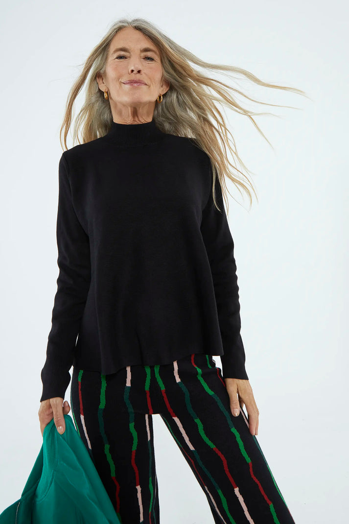 Black A-line turtleneck sweater