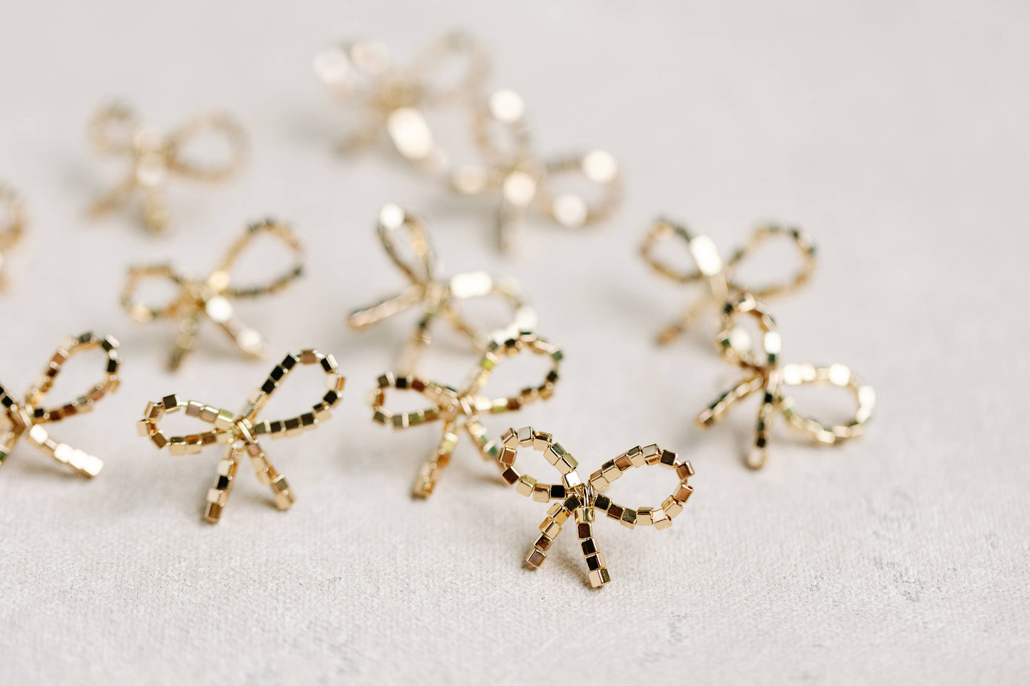 St Armands Designs of Sarasota - Mini Gold Beaded Bow Holiday Statement Earrings