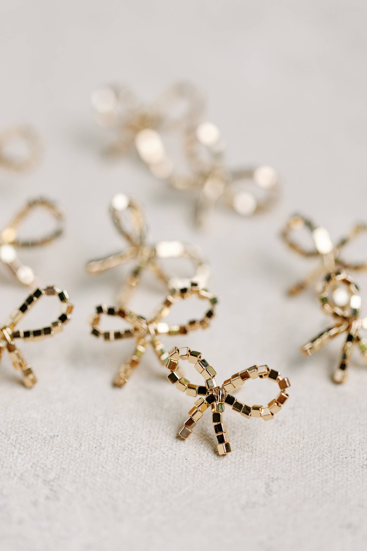 St Armands Designs of Sarasota - Mini Gold Beaded Bow Holiday Statement Earrings