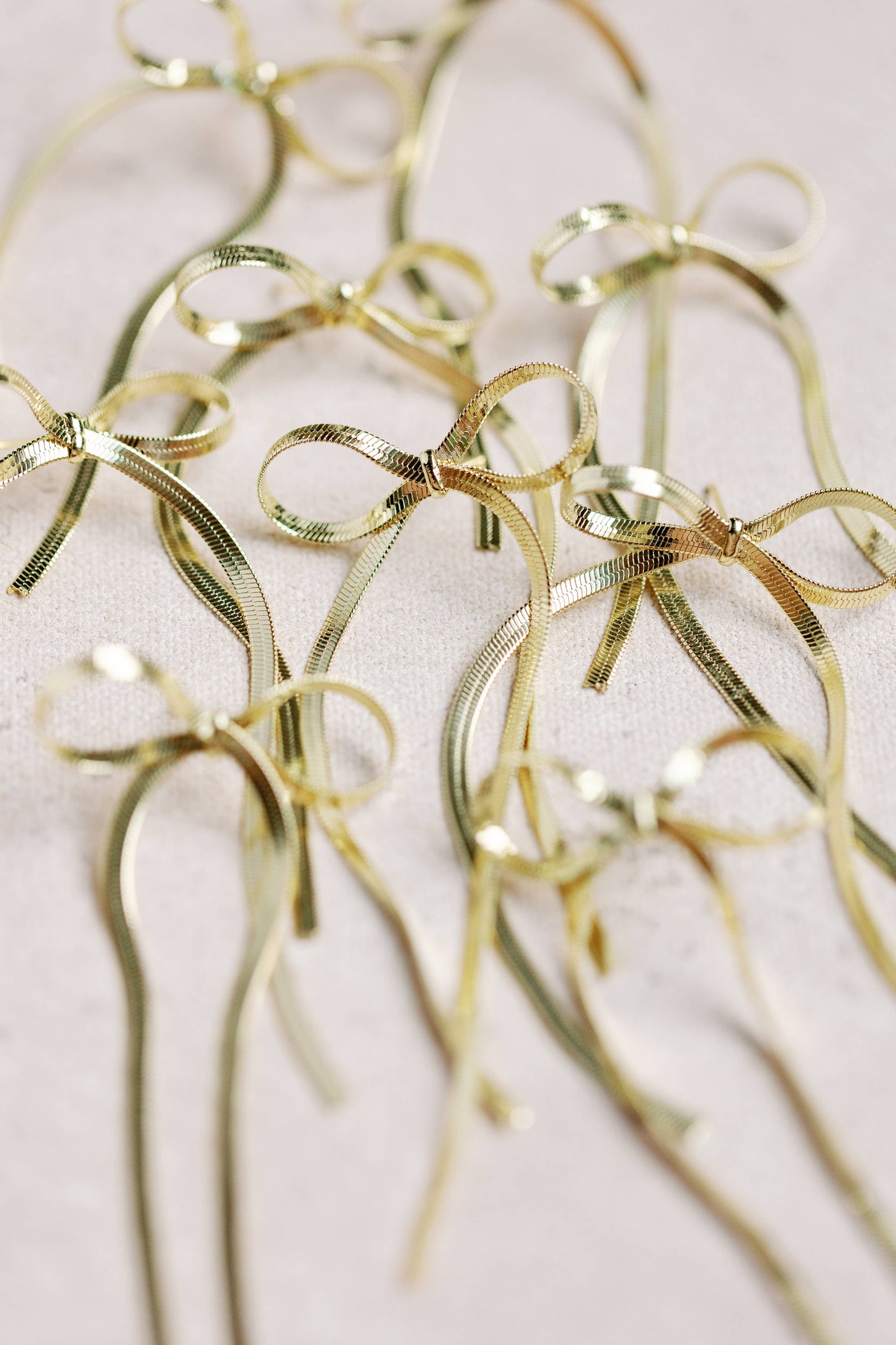 St Armands Designs of Sarasota - Maxi Gold Duster Bow Holiday Statement Earrings